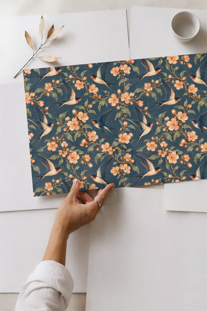 Multiple swallows flying in different directions on floral wallpaper