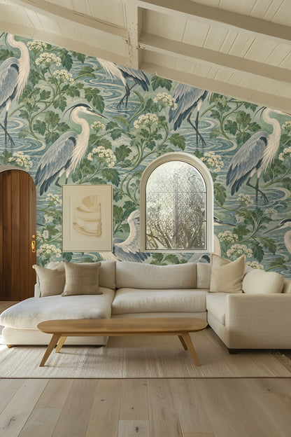 Bedroom with wood headboard and Celadon Heron Loops wallpaper behind the bed.