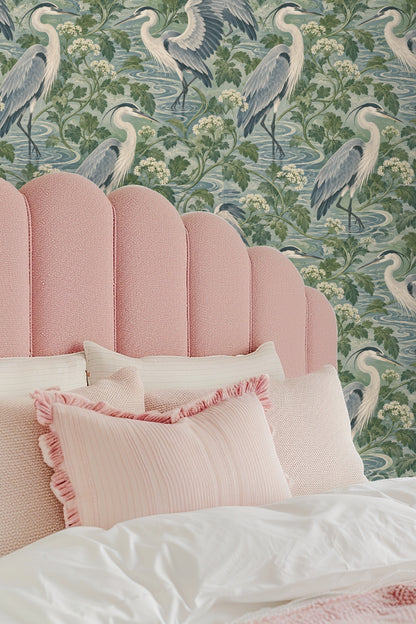 Elegant heron standing with wings partially open in pattern detail.
