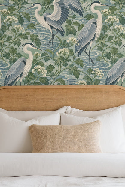 Detailed view of Celadon Heron Loops wallpaper featuring blue-grey herons and foliage.