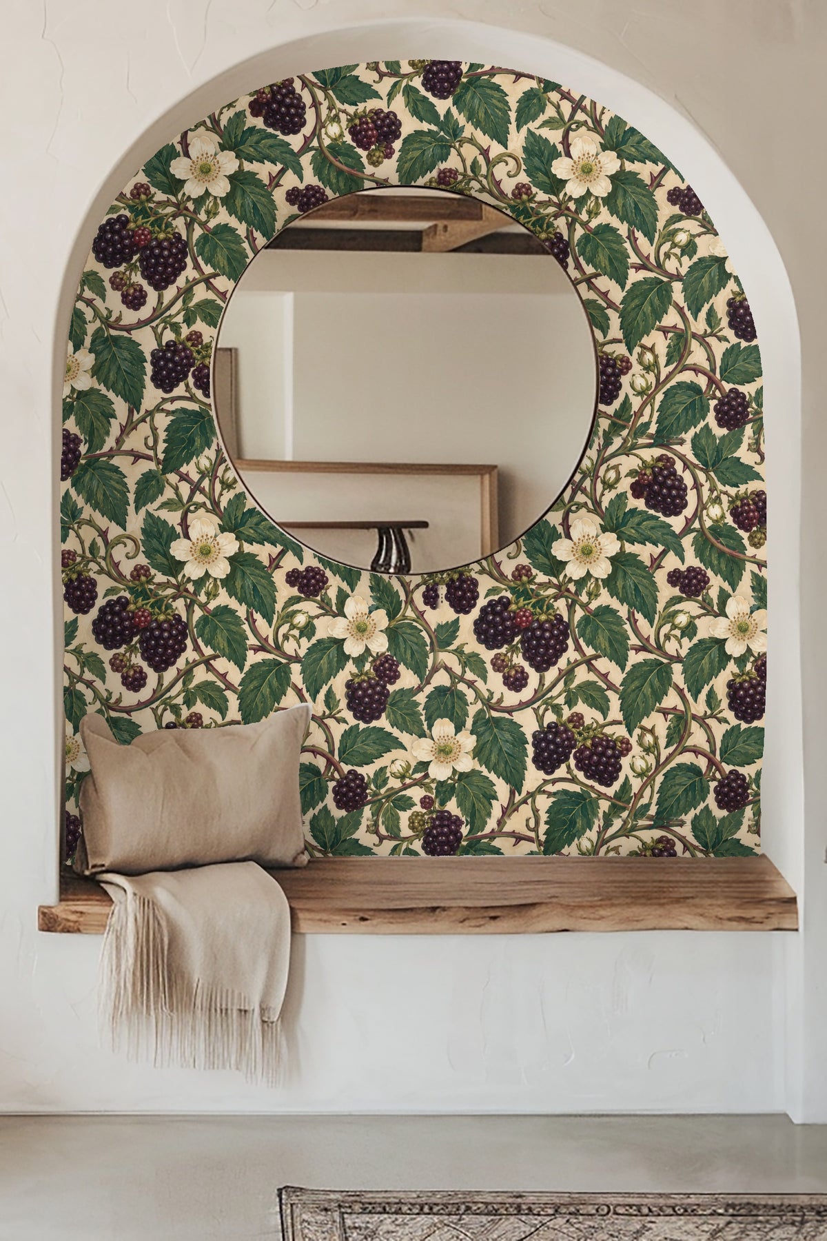 Bramble Lantern Weave wallpaper behind a candle and delicate white flowers on a wooden surface, showing scale and cozy ambiance.