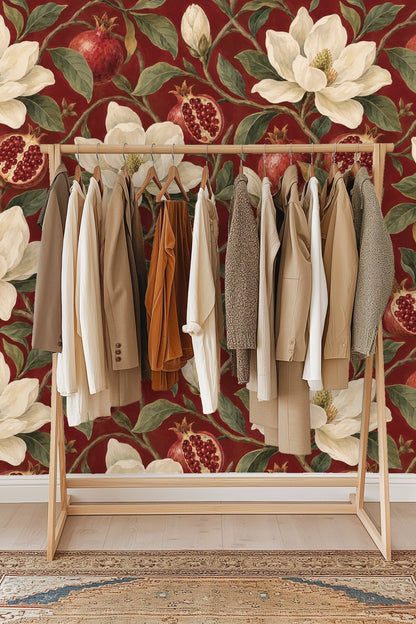 Pomegranates, some whole and some open, showing seed details in a painterly wallpaper design.