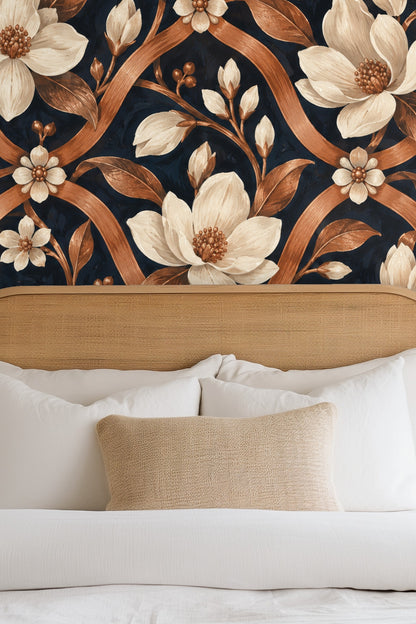 Copper trellis wallpaper with cream magnolia blossoms on navy background, close-up detail
