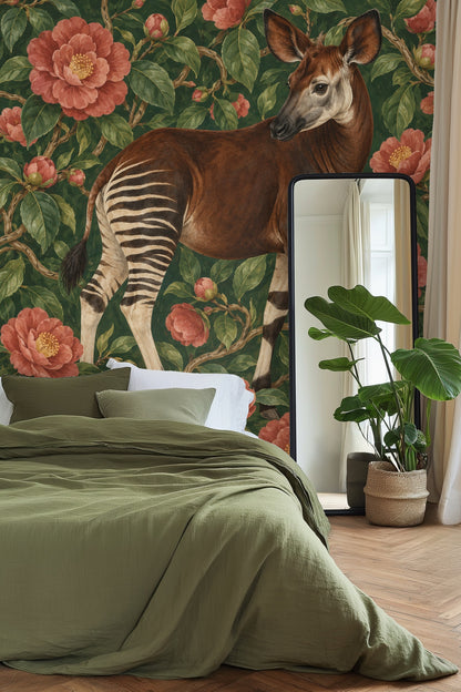 Modern chair beside wallpaper with okapi and lush floral pattern in moody room