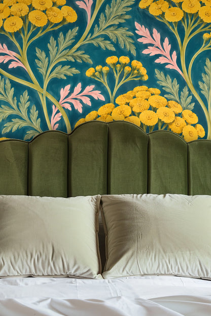 Close-up of painted wallpaper showing yellow tansy flowers and green leaves on a deep teal background