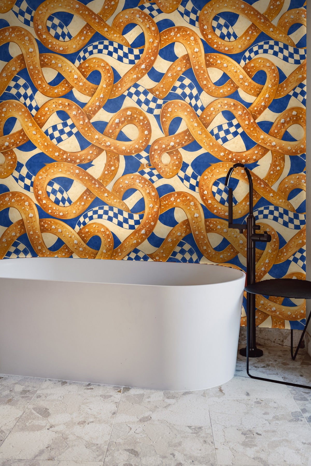 Pattern showing looping pretzel shapes in warm orange tones
