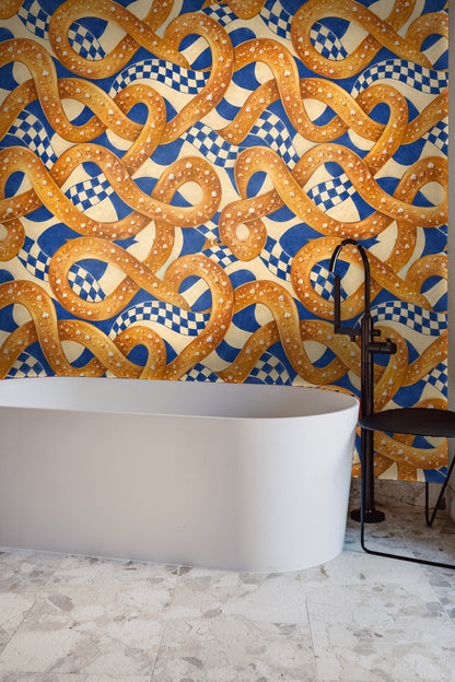 Pattern showing looping pretzel shapes in warm orange tones