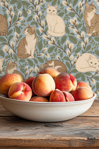 Close-up of tabby cat sitting on pussywillow branch in the wallpaper pattern