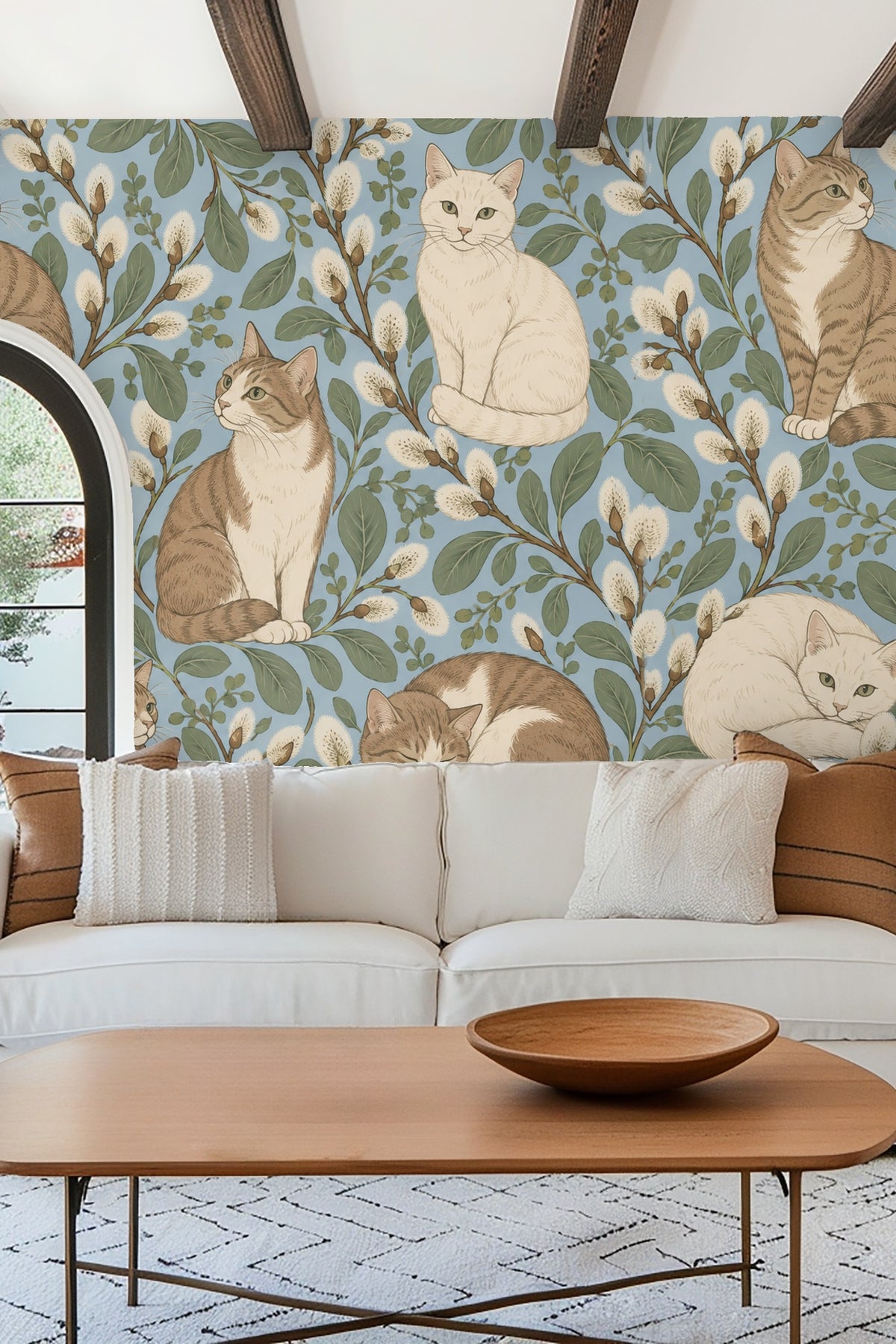 White cat sitting facing forward with green eyes among botanical elements in the design