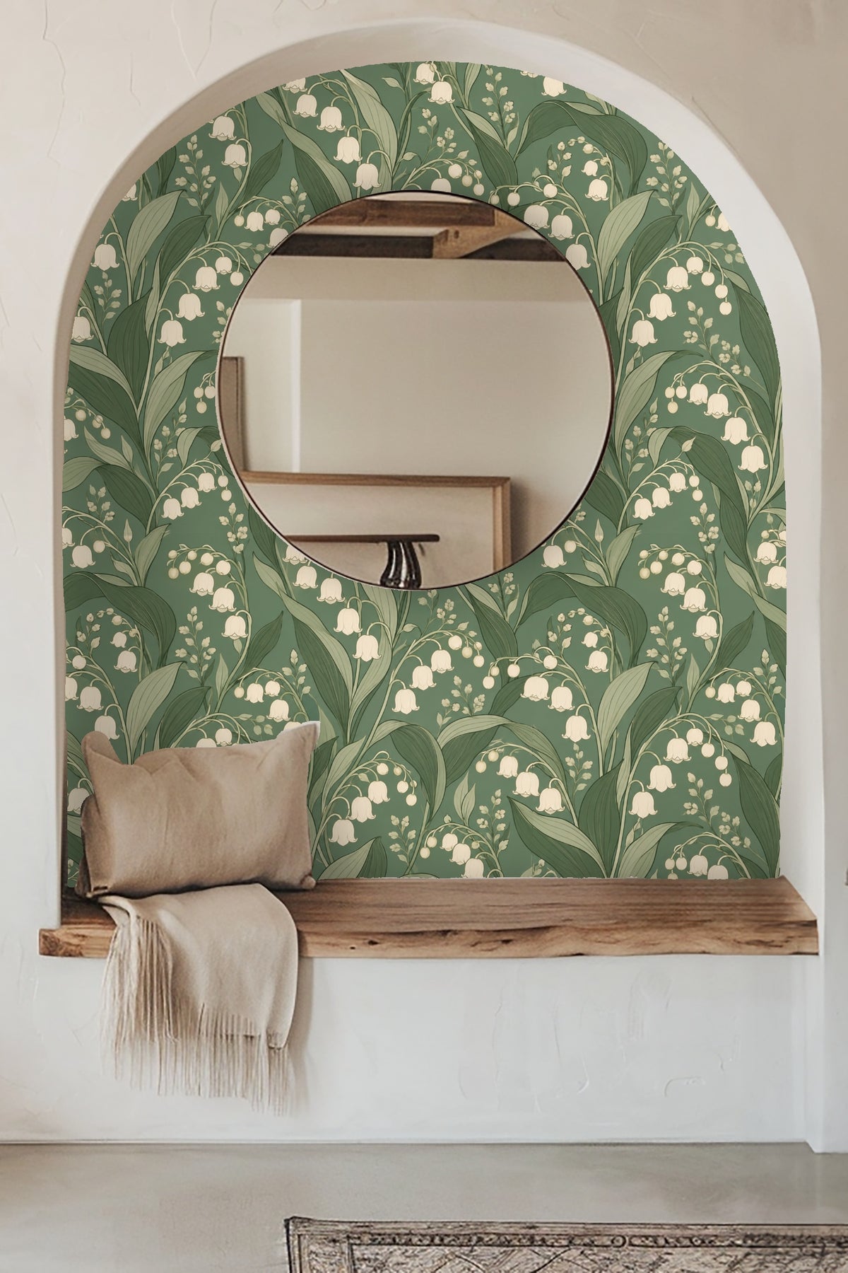 Living room scene with a deep blue velvet couch in front of Verdant Lily Bells wallpaper