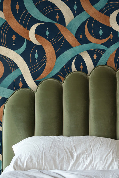 Wallpaper in a bedroom setting with soft pink and beige bedding