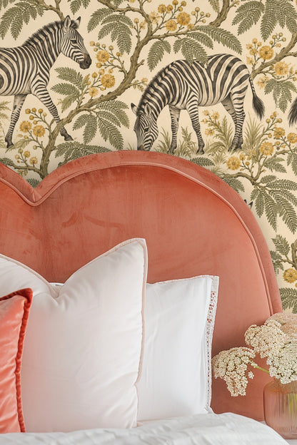 Wallpaper close-up showing zebras grazing among mimosa branches with yellow flowers on a beige background