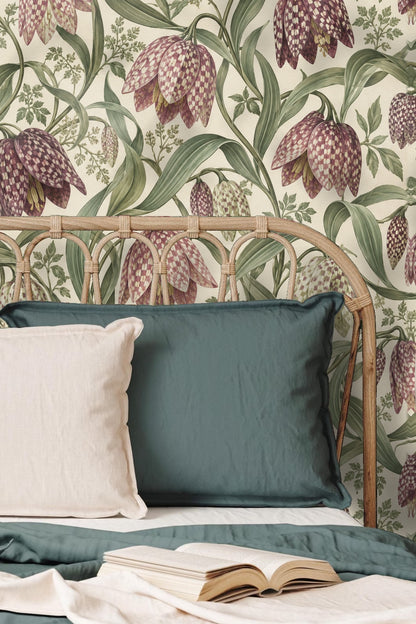 Playroom corner with floral wallpaper behind wicker chair and children's play table