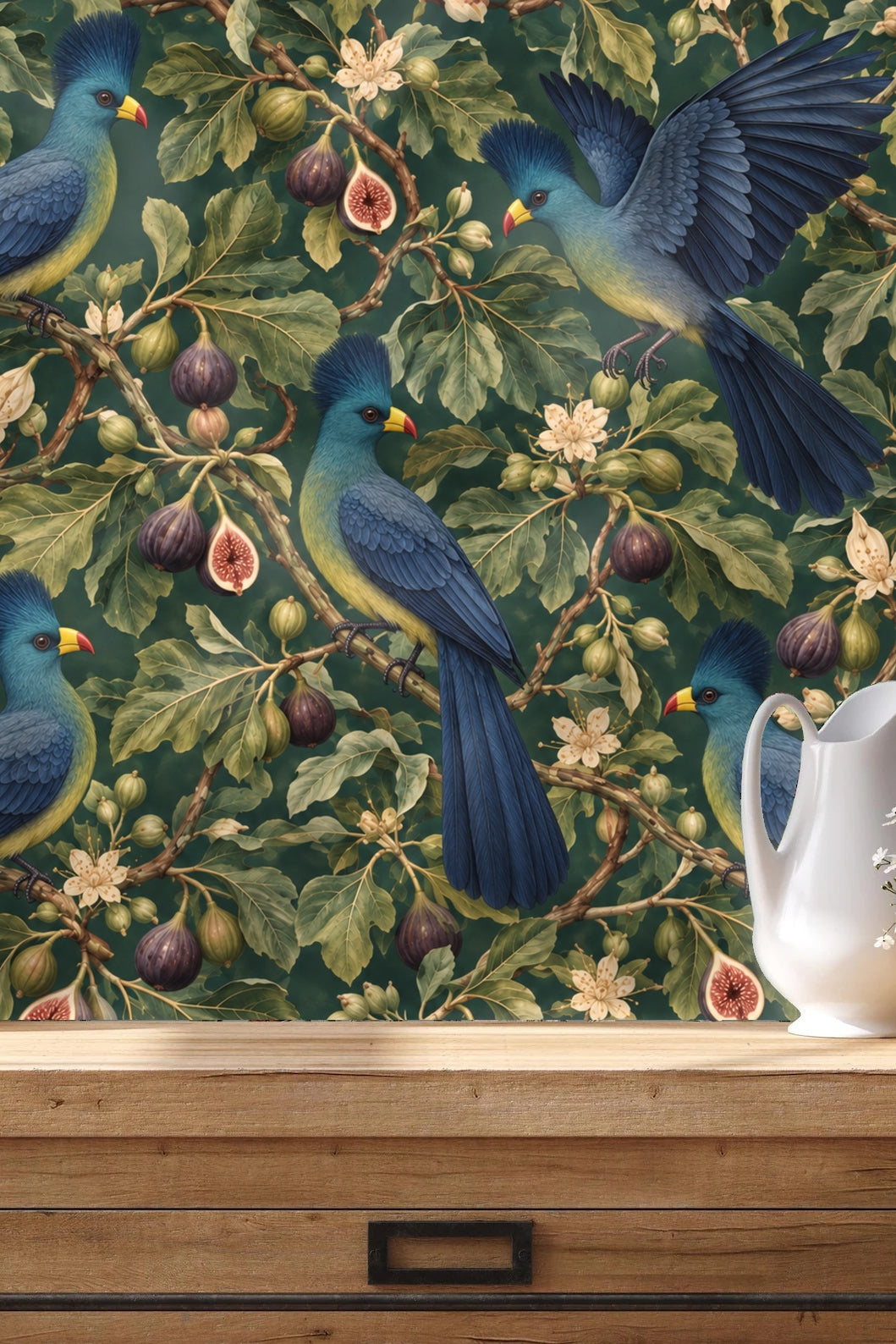 Close-up detail of ripe figs and fig flowers interspersed with blue crest Turaco birds on wallpaper.