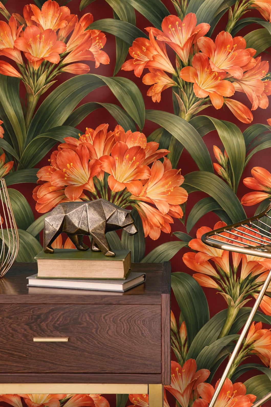 Corner view of burgundy clivia wallpaper showing scale and floral pattern near wooden furniture