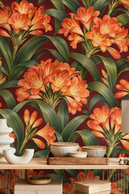 Close-up showing texture impression of glossy orange petals on burgundy backdrop
