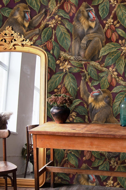 Close-up of mandrill face and cocoa branches in wallpaper design