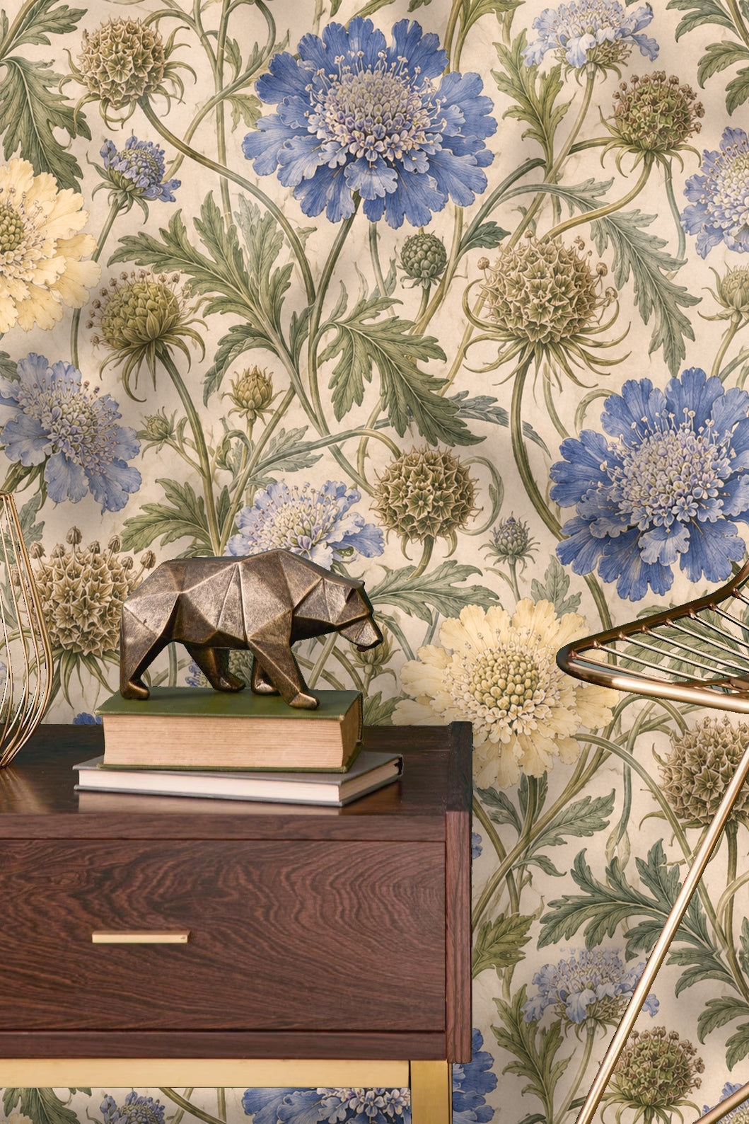 Yellow scabious bloom surrounded by leafy stems and seed pods