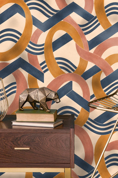 Close-up of Amber Orbit Weft wallpaper colors: amber, dusty rose, cobalt blue, and cream