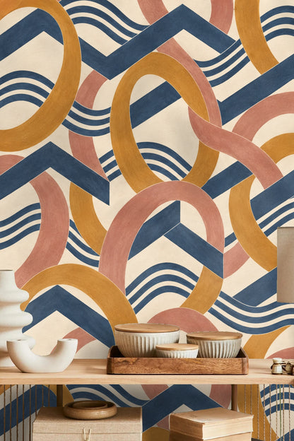 Side view of room with amber and blue geometric wallpaper, white dollhouse, and rattan chairs