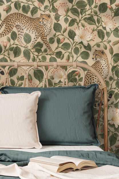 Playroom space featuring cheetah and floral mural wallpaper behind child-sized furniture and toys