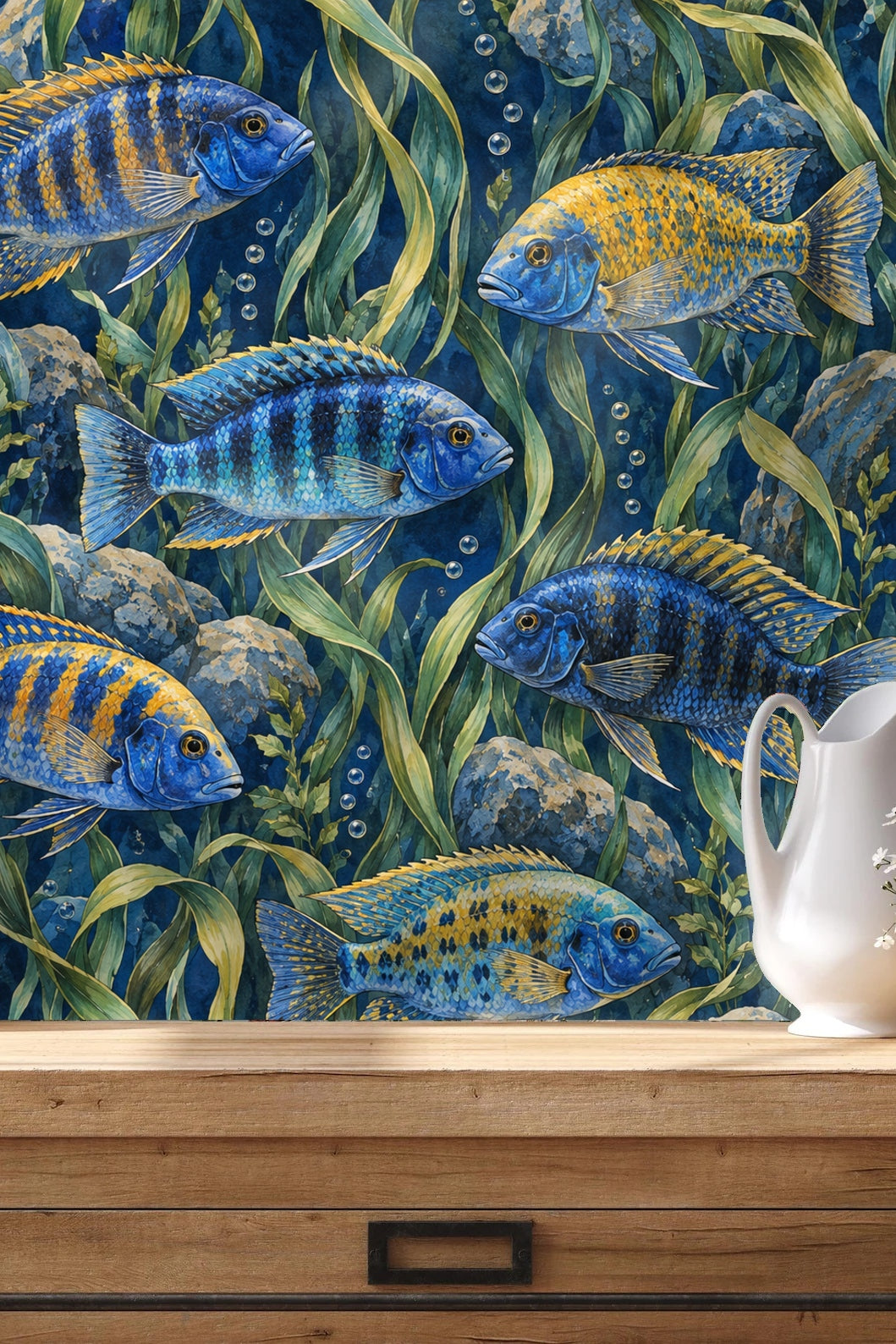 Side angle of the cichlid fish design showing brushstroke textures and layered aquatic plants.