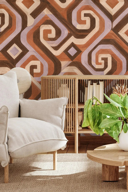 Detailed view of Walnut Spiral Steps wallpaper showing interlocking spirals and geometric shapes in brown, terracotta, cream, and lilac hues