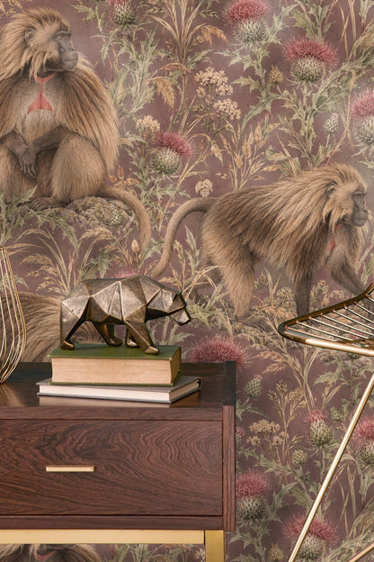 Table and chairs in front of Gelada Highland Thistle wallpaper accent wall.