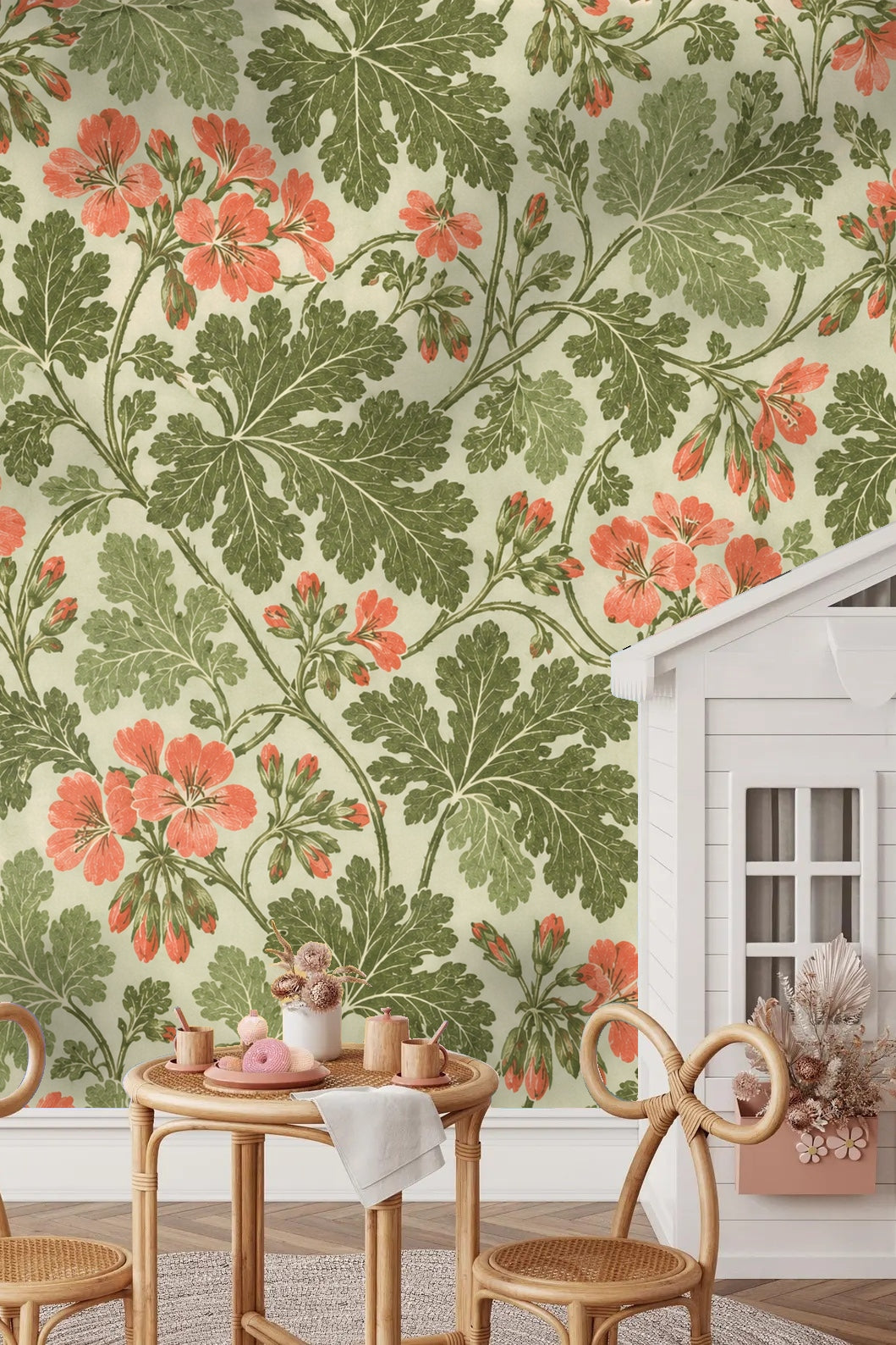 Living room corner with pelargonium leaf lace wallpaper and a plush cream armchair