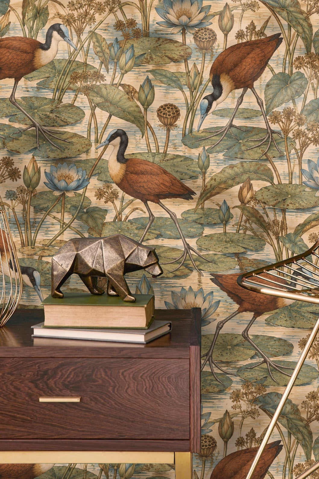 Room view with Jacana Lily Step wallpaper behind a beige armchair and wooden cabinet
