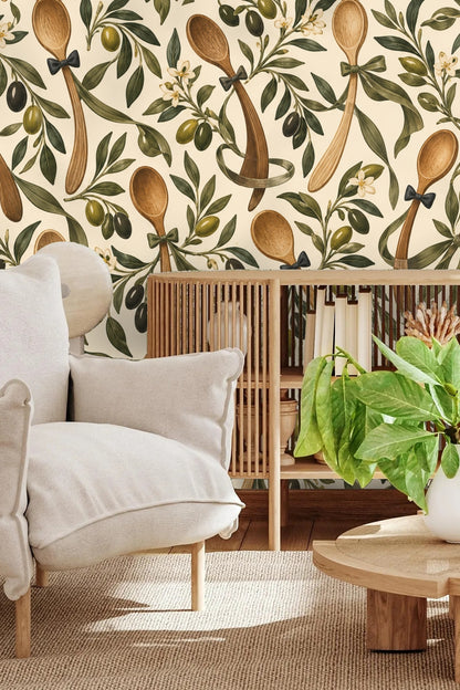 Playroom wall covered with playful Olive Spoon Waltz wallpaper featuring wooden spoons and olives with a small table and chairs below.