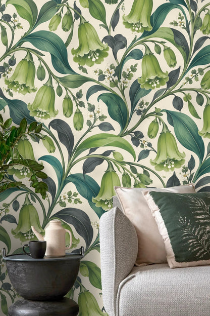 Wallpaper detail of green bell-shaped flowers and leaves on cream background