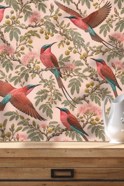 Living room with Bee-Eater Bloom Wallpaper behind a natural wood console and beige armchair