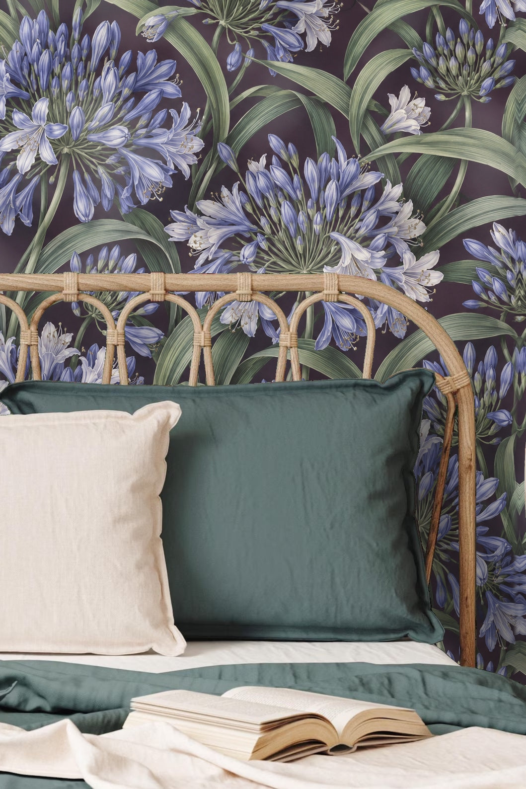 Close-up of Agapanthus Rainwheel wallpaper showing detailed blue and white agapanthus flowers with green leaves on a dark violet background.