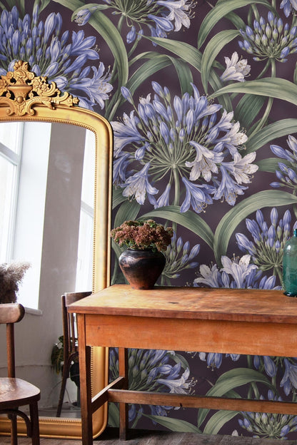 Segment of Agapanthus Rainwheel wallpaper focusing on intertwined green leaves and flower clusters.