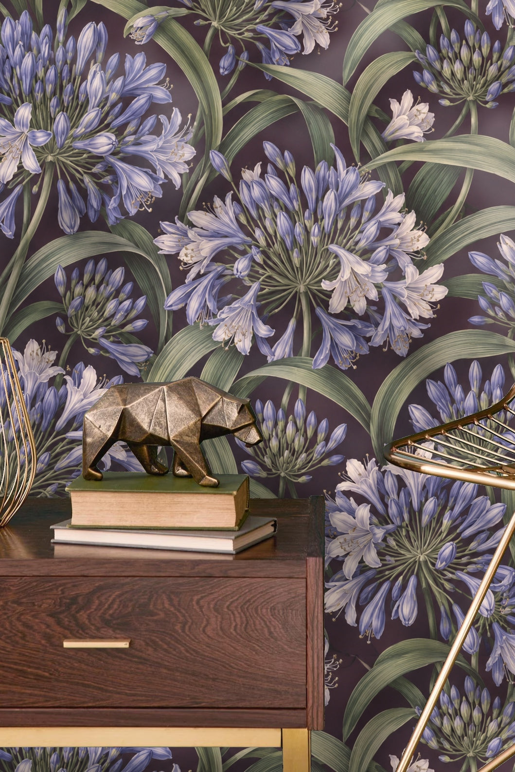 Partial view of a wall with Agapanthus Rainwheel wallpaper behind a wooden chair.