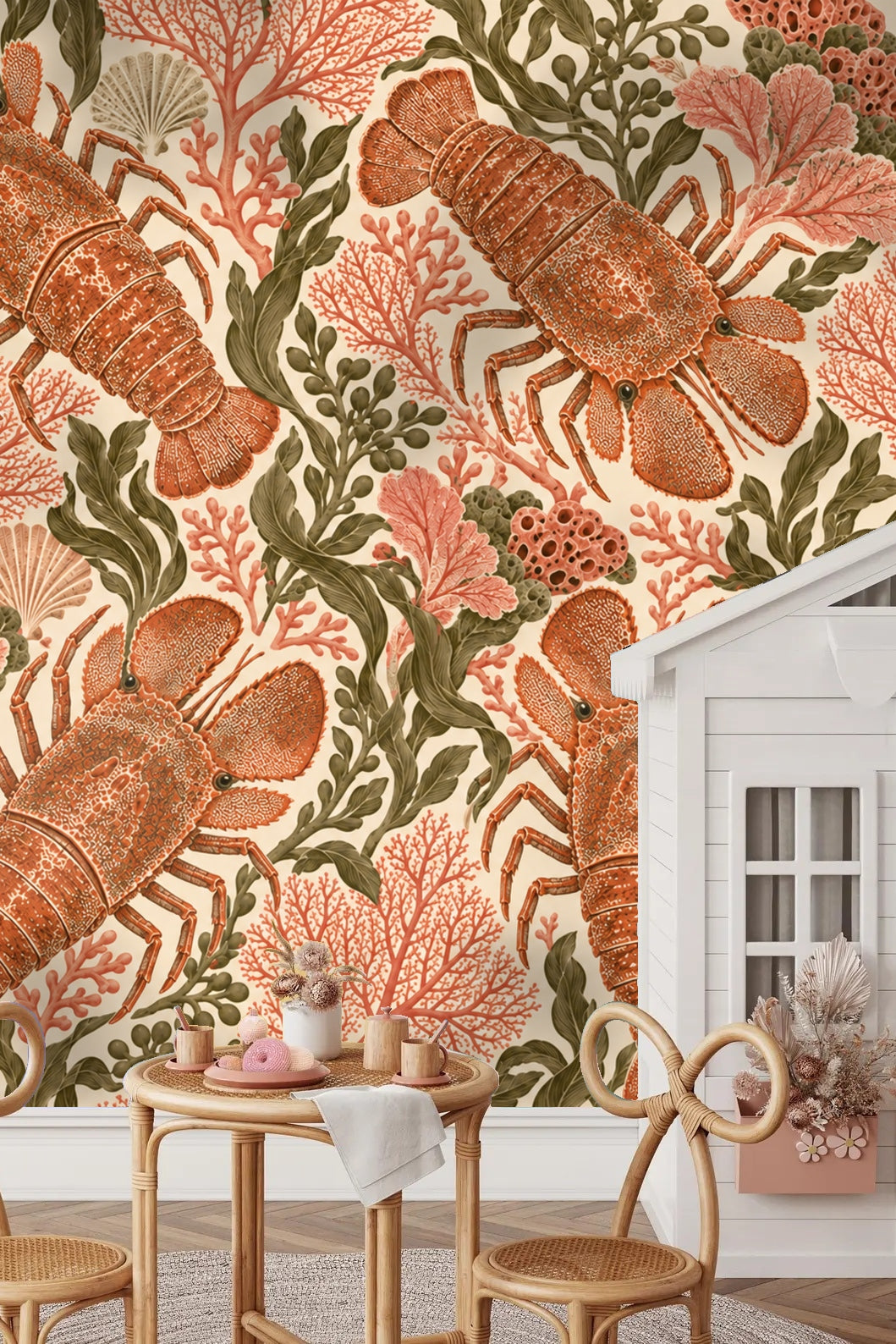 Living room accent wall with slipper lobster coral wallpaper behind blush velvet chair