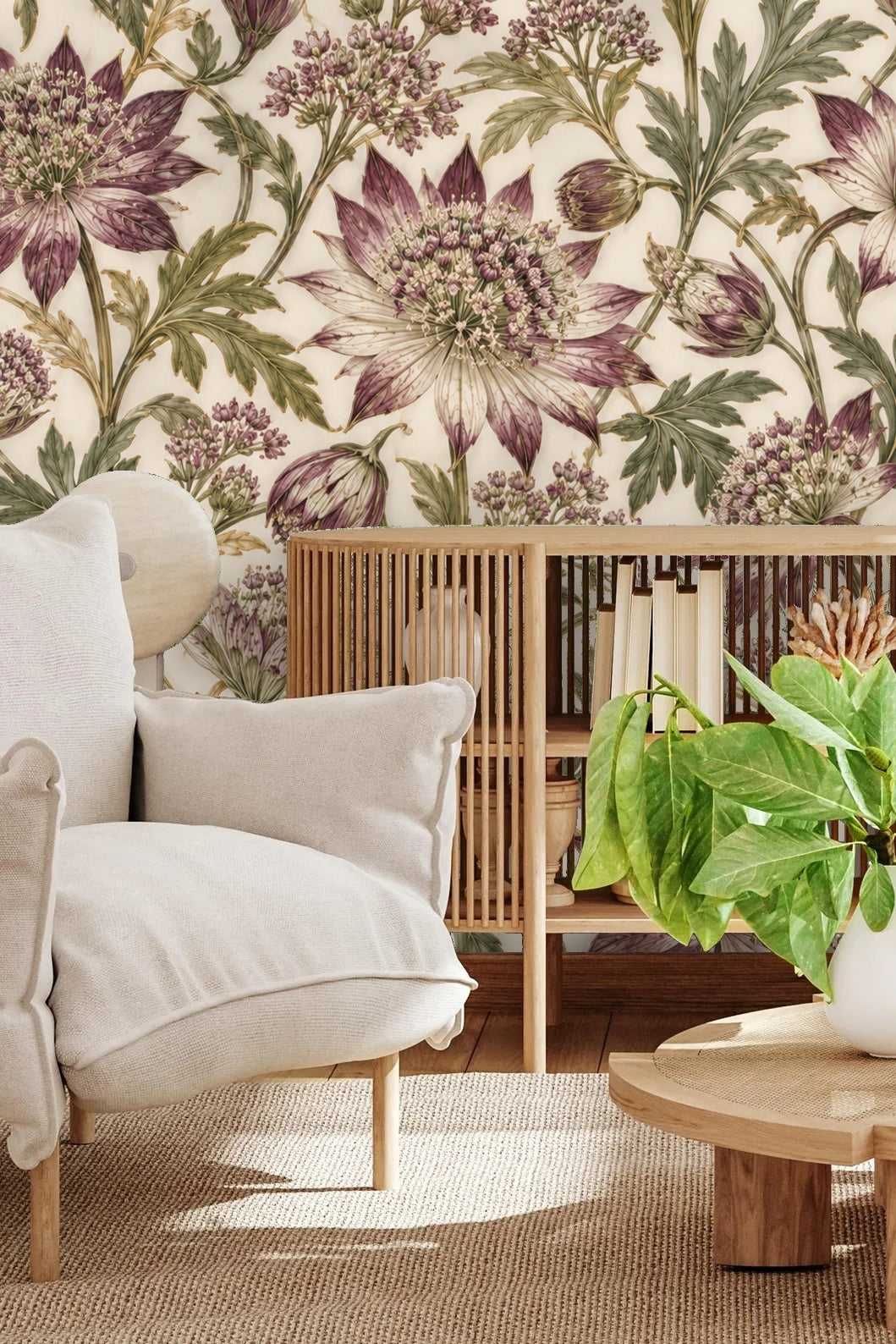 Living room corner with cream chair and wooden console against astrantia floral wallpaper.