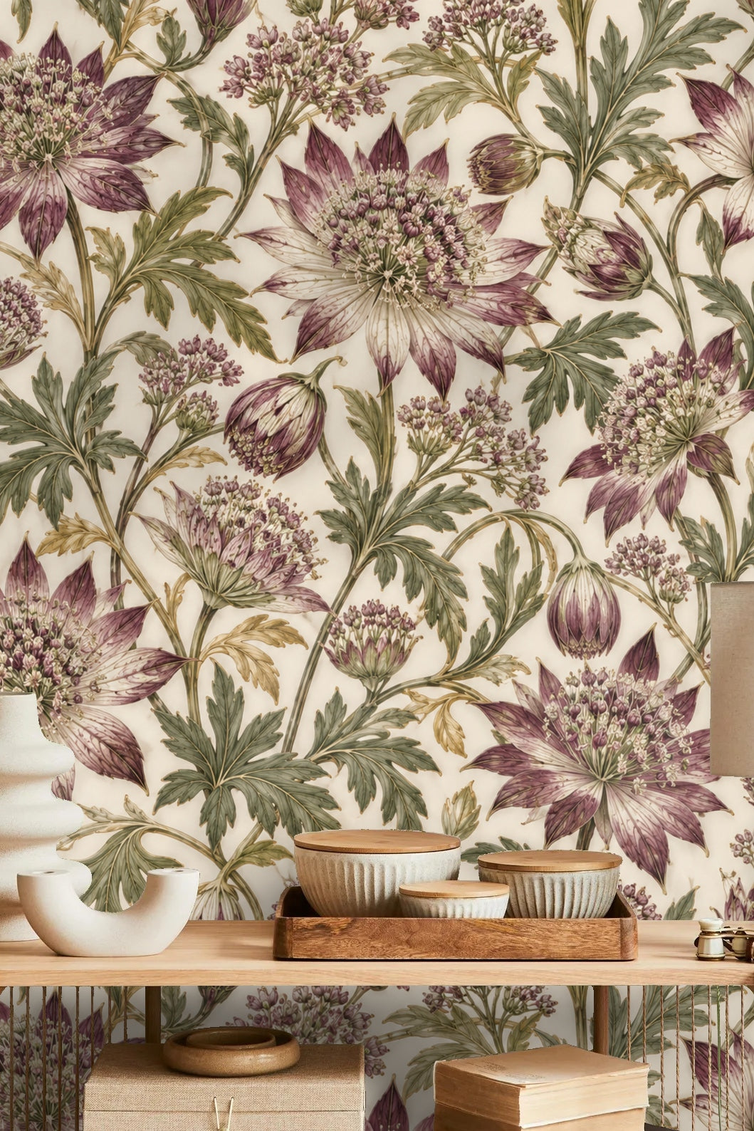 Detail of dense astrantia floral pattern with plum petals and green foliage on cream base.