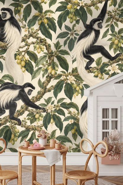 Living room featuring Colobus Tassel Canopy wallpaper behind a beige corduroy sofa and rattan cabinet.
