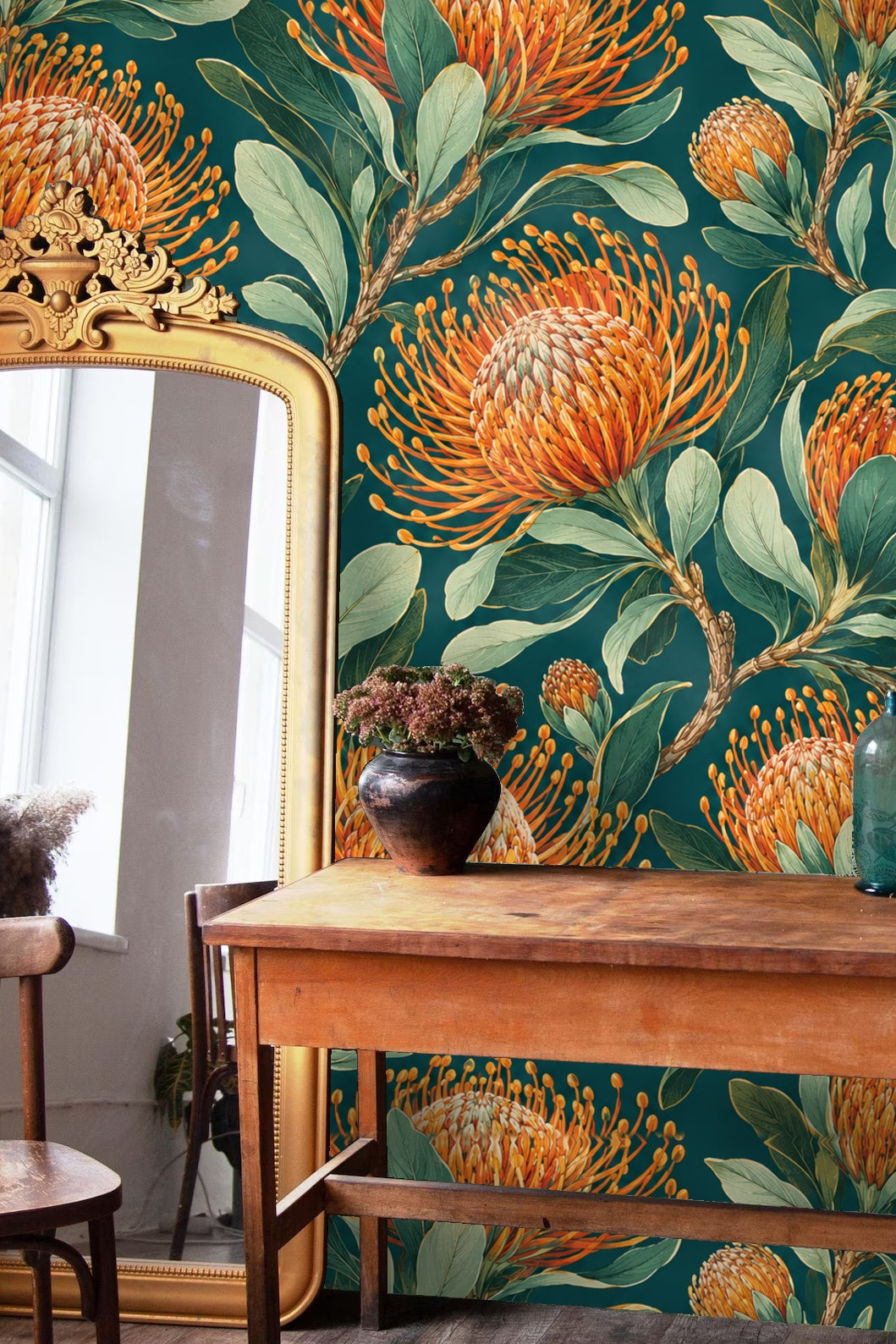 Close-up of orange pincushion protea flowers with elongated petals and green leaves on teal background wallpaper.