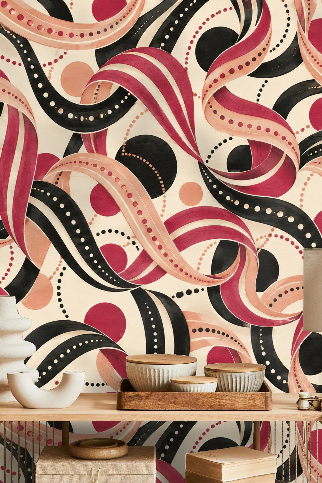 Soft peach and black dotted circles punctuating flowing red ribbons in wallpaper design
