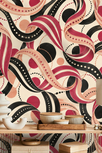 Soft peach and black dotted circles punctuating flowing red ribbons in wallpaper design