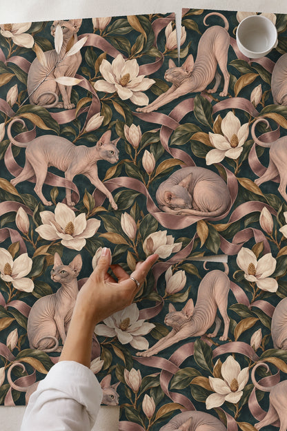 Magnolia flower with green and brown leaves amidst textural pink ribbons.