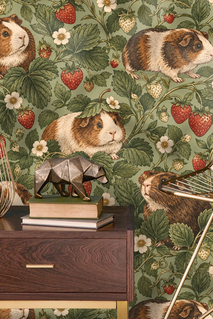 Green leaves and white strawberry blossoms with guinea pig motif