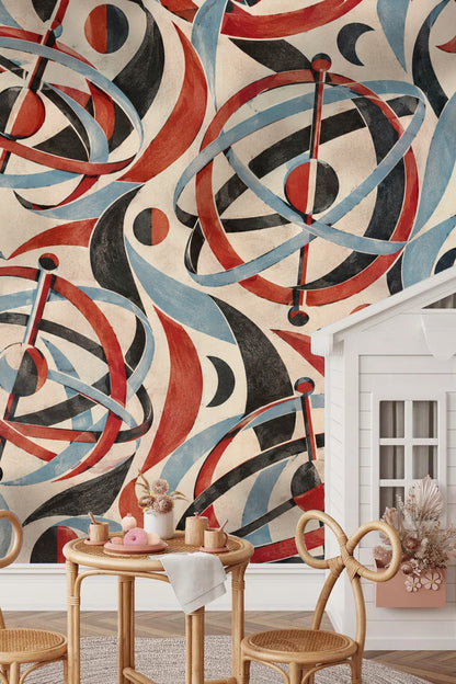 Abstract mural in living room space with Madder Gyroscope Garden wallpaper showing swirling rings and spheres in red, blue, and black