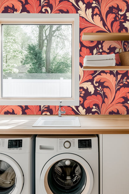 Living room featuring coral acanthus wallpaper with orange mid-century sofa and rug.