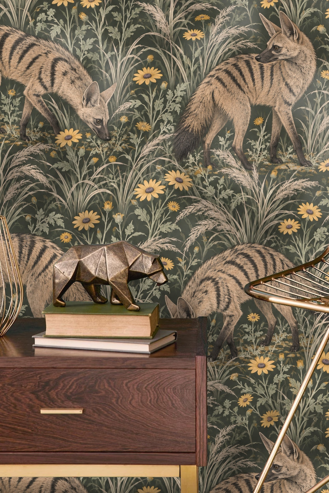 Hand holding aardwolf wallpaper sample with cup and dried leaves nearby