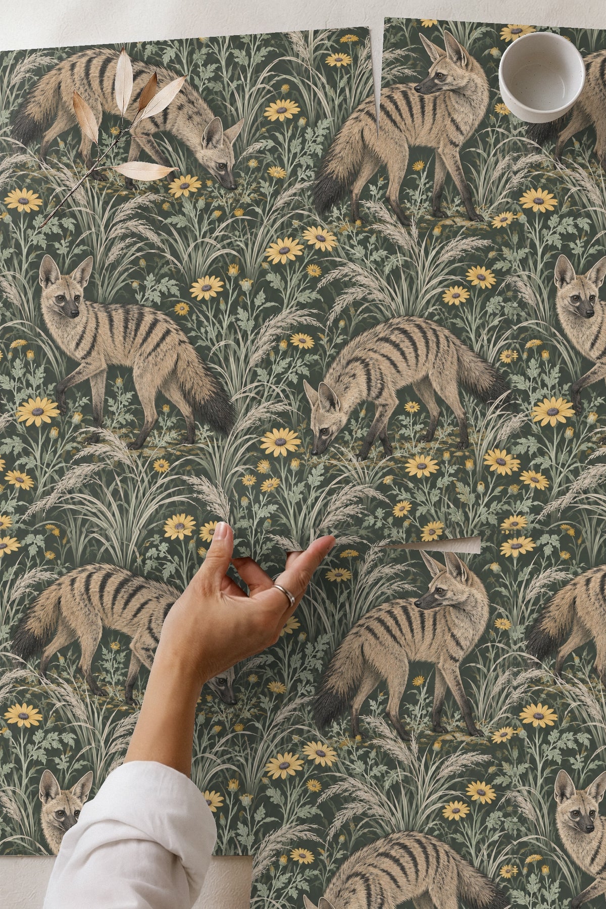 Living room featuring green chair and tabletop with aardwolf meadow wallpaper