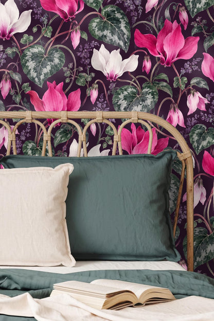 Dark plum background layered with dense cyclamen stems and small purple foliage